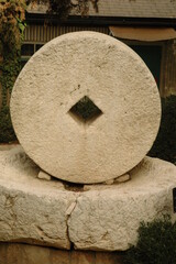 Ancient, stone olive press and grindstone.