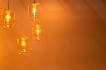 Glowing lamps hanging on ceiling