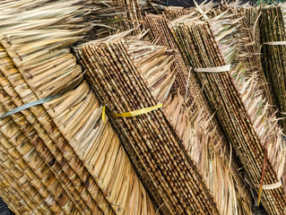 Nipa roofing shingle materials for sale at a local handicraft store. Local trade in Southeast Asia....