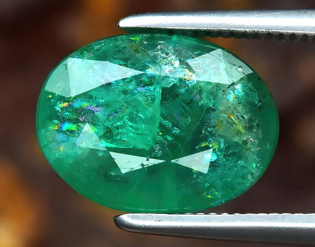 natural green emerald beryl gem on the background