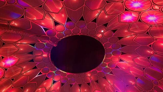 Colorful digital display projection on the ceiling with abstract kaleidoscope pattern