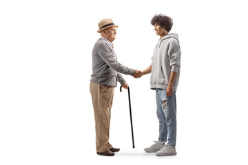 Elderly man meeting a young man and shaking hands