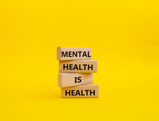 Mental Health symbol. Wooden blocks with words Mental Health is Health. Beautiful yellow...