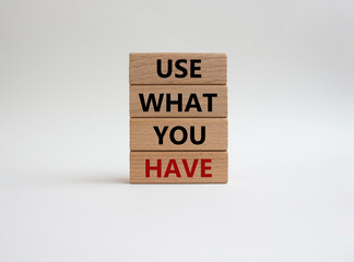 Use what you Have symbol. Concept words Use what you Have on wooden blocks. Beautiful white background. Business and Use what you Have concept. Copy space.