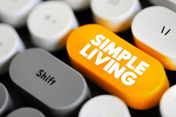 Simple Living - practices that promote simplicity in one's lifestyle, text concept button on...
