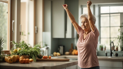 Active senior woman making effort while stretching arms on kitchen counter and doing physical exercises in the morning
