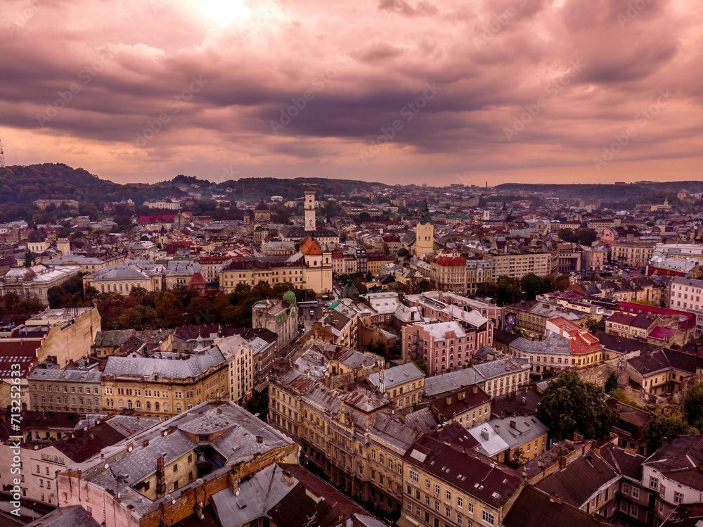 Poster Aerial view of Lviv's historic cityscape at dusk, with a tapestry of vibrant, ancient buildings