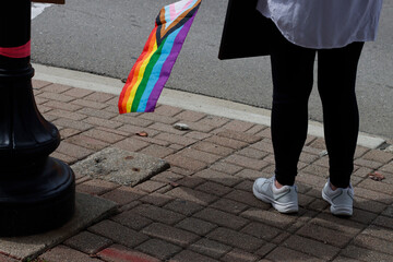 Holding a LGBT rights flag