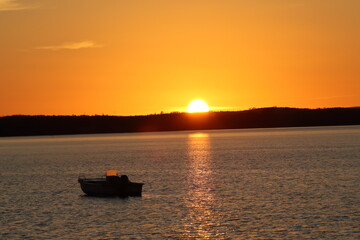 Fototapeta na wymiar Sailing into the sunset in Pictou County NS 
