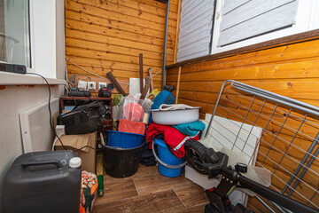 trash and disorder of unnecessary things from the storage area in a container located on the...