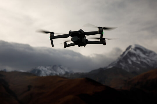 Small military drone gathering intel.