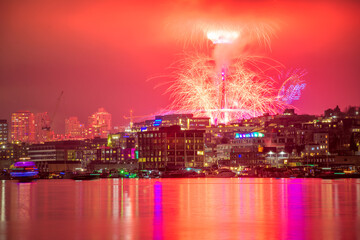 Fototapeta na wymiar Scenic view of vibrant fireworks illuminate the night sky of Seattle