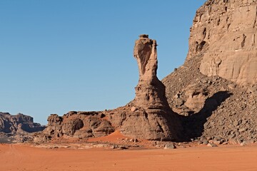 Fototapeta na wymiar View of the landscape and the Coup d'Afrique rock formations in the Sahara desert. Tadrart Rouge in Tassili n´Ajjer National Park. Algeria. Africa.