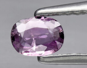 natural purple sapphire gem on the background