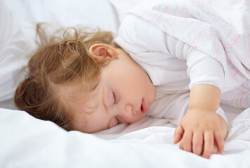 Face, baby and kid sleeping on bed for calm break, peace and dreaming to relax at home. Tired young child asleep with blanket for newborn development, healthy childhood growth or rest in nursery room