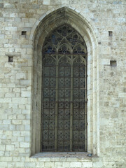 Fototapeta na wymiar Old windows of a historical building in medieval european city