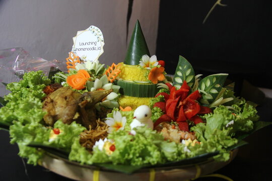 Tumpeng rice is a traditional food that is usually made when there is a special event, this rice is shaped like a cone and decorated as beautifully as possible