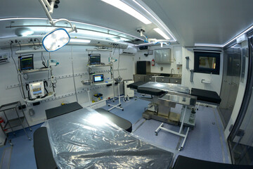 Interior of a modern military mobile hospital operation tables, reviving apparatuses, other medical equipment, made in Ukraine.