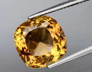 natural yellow imperial topaz gem on the background