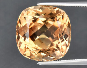 natural yellow imperial topaz gem on the background
