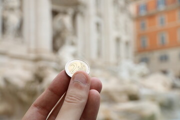 Coin toss into the Trevi Fountain, Rome.