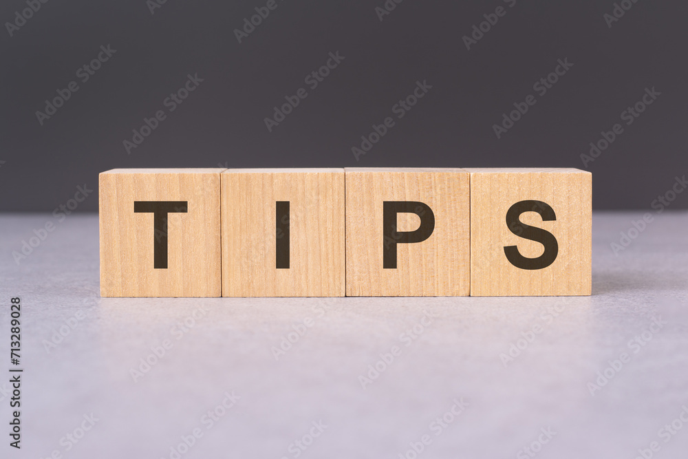 Poster cubes forming the word tips concept related to guidance, advice, and helpful suggestions. the use of