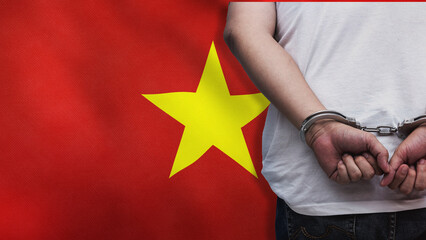 A man getting under arrest in Vietnam. Concept of being handcuffed, detained, incarcerated and...