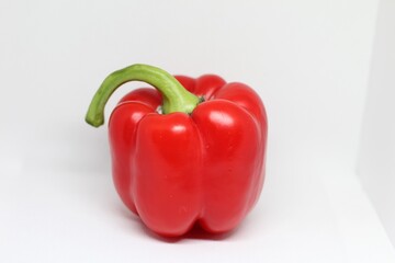 Red pepper with a green tail