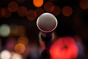 Close-up of microphone in concert hall or stand up club.
