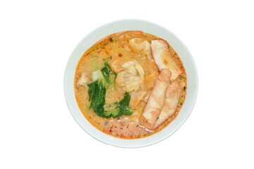 Chinese dumpling topping boiled red barbecue pork with cabbage in tom yum soup on bowl