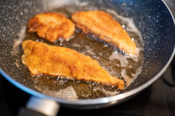 fried chicken meat in a pan