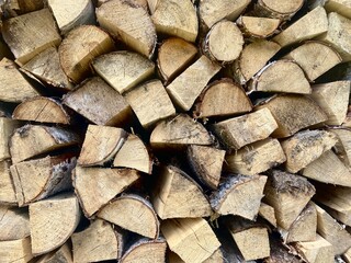 natural wooden background. firewood stacked on top of each other close-up 