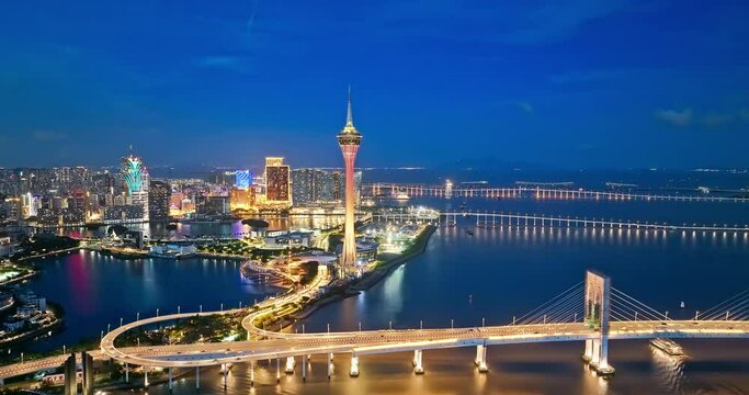 Aerial panning shot of Macau architecture skyline and bridge transportation