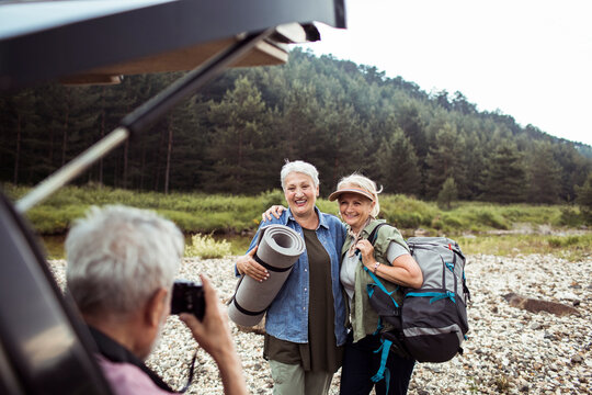 Happy senior people taking group photo in nature