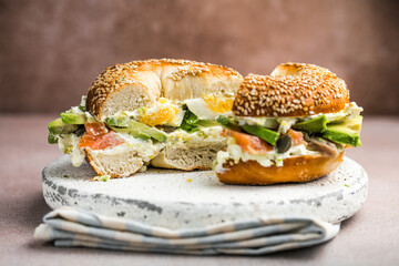 Hearty Breakfast Sandwich on a Bagel with avocado, salmon, egg