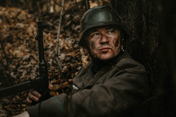 photo of a Wehrmacht soldier against the background of the forest