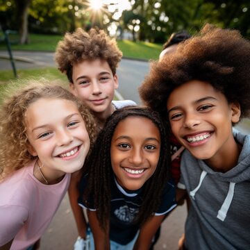 group of smiling multicultural kids looking at camera in park on sunny day. AI.