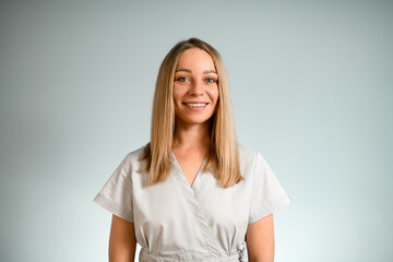 Portrait photo of a beautiful smiling woman with a long blond hair