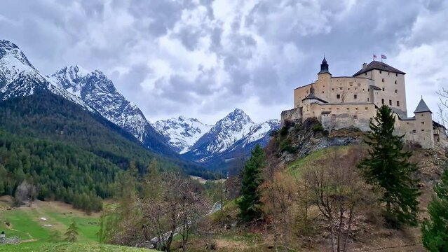 Impressive mountain scenery with amazing medieval castle Tarasp surrounded by Swiss Alps, Canton Grisons or Graubuendon, Switzerland