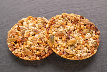 Two Thaler cookies on a slate stone, macro.