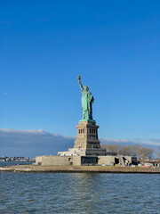 New York, New York – January 11, 2024: the view of the Statue of Liberty from the ferry boat with...