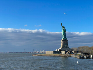 New York, New York – January 11, 2024: the view of the Statue of Liberty from the ferry boat with tourists