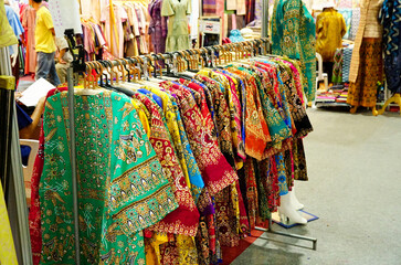 Colorful Clothes hanging for sale in the shop