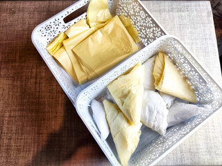 Plastic bag folded into a triangle for storage. Ways of storing and laying at home