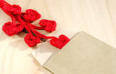 Knitted hearts and envelope for Valentine's Day.