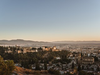 Panoramic view of the castle Alhambra in Granada, Andalusia, Spain, during sunset, from the Mirador de la Cruz de Rauda