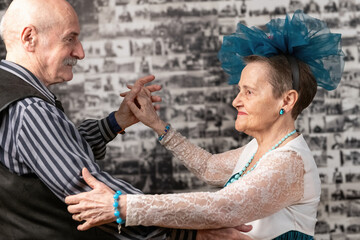 Senior couple gracefully dances, embodying the beauty of shared moments and the joy found in the...