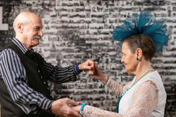 Seniors showcase timeless elegance in a ballroom dance, celebrating life's rhythms with graceful...