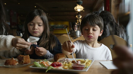 Kids eating food at diner, children enjoying cozy restaurant, siblings little brother and sister