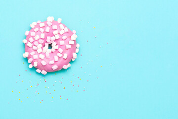Delicious donut on color background